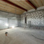 Large garage for two cars with of the gate. overhaul and reconstruction. Working process of warming inside part of roof. House or apartment is under construction, remodeling, renovation, restoration. Large garage for two cars with of the gate. overhaul and reconstruction. Working process of warming inside part of roof. House or apartment is under construction, remodeling, renovation, restoration.